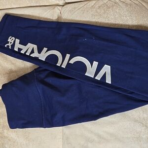 VS knockout sport  leggings in blue with silver & gold glitter writing down leg